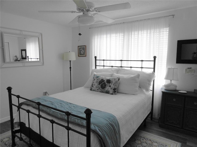 4022 Beaver Ln Unit 700B, Port Charlotte, FL 33952 - bedroom featuring wood finished floors and a ceiling fan