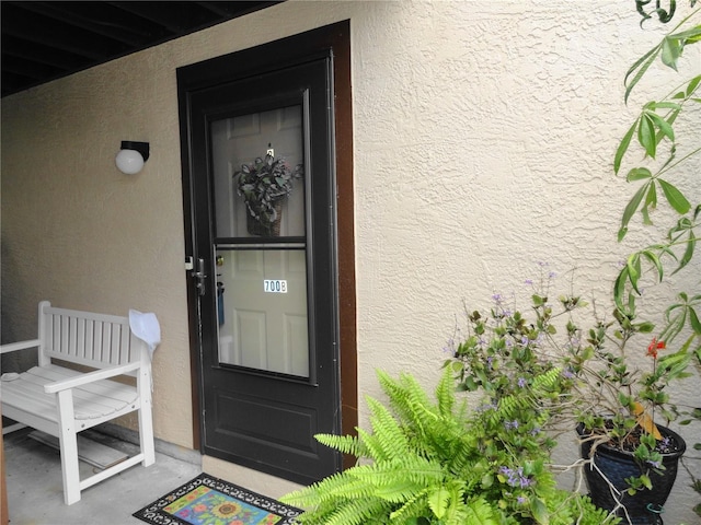 4022 Beaver Ln Unit 700B, Port Charlotte, FL 33952 - view of exterior entry featuring stucco siding