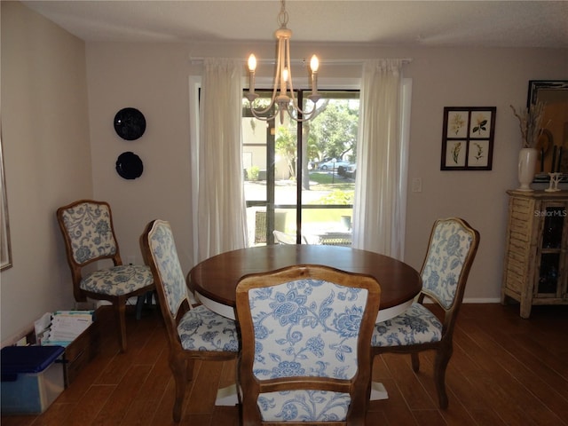 4022 Beaver Ln Unit 700B, Port Charlotte, FL 33952 - dining room featuring wood finished floors and a chandelier
