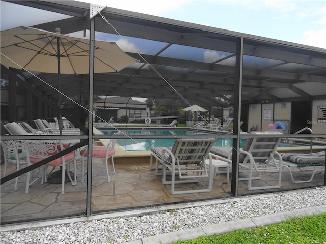 4022 Beaver Ln Unit 700B, Port Charlotte, FL 33952 - community pool featuring a patio area and glass enclosure