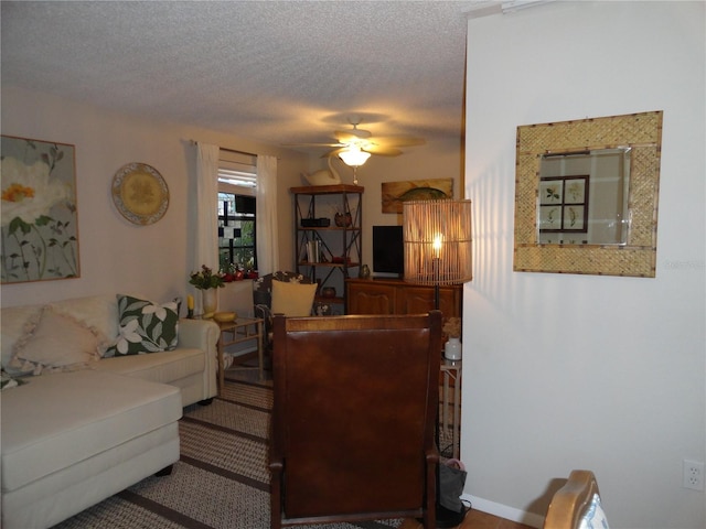 4022 Beaver Ln Unit 700B, Port Charlotte, FL 33952 - living room with a ceiling fan and a textured ceiling
