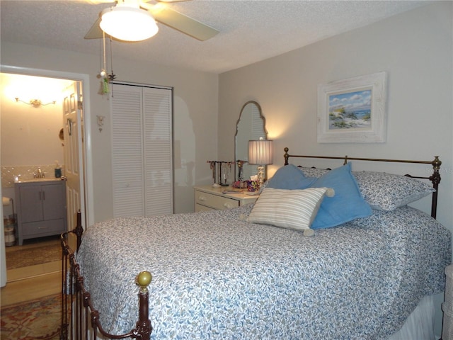 4022 Beaver Ln Unit 700B, Port Charlotte, FL 33952 - bedroom with a closet, connected bathroom, and a ceiling fan