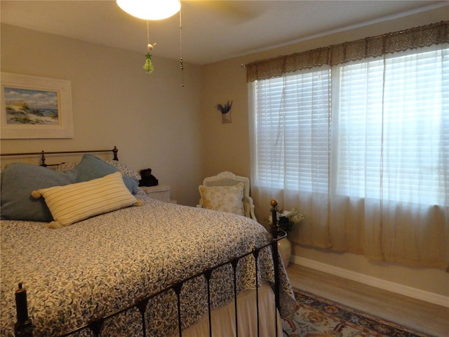 4022 Beaver Ln Unit 700B, Port Charlotte, FL 33952 - bedroom featuring wood finished floors and ceiling fan