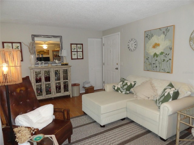 4022 Beaver Ln Unit 700B, Port Charlotte, FL 33952 - living area featuring wood finished floors and a textured ceiling