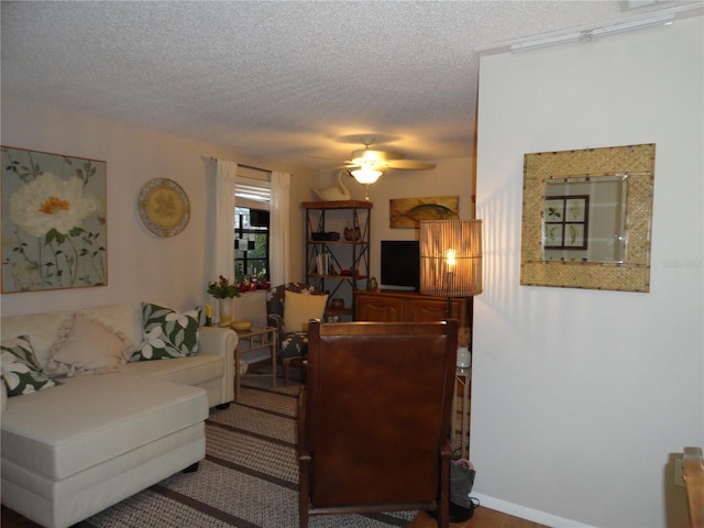 4022 Beaver Ln Unit 700B, Port Charlotte, FL 33952 - living area featuring a textured ceiling and a ceiling fan