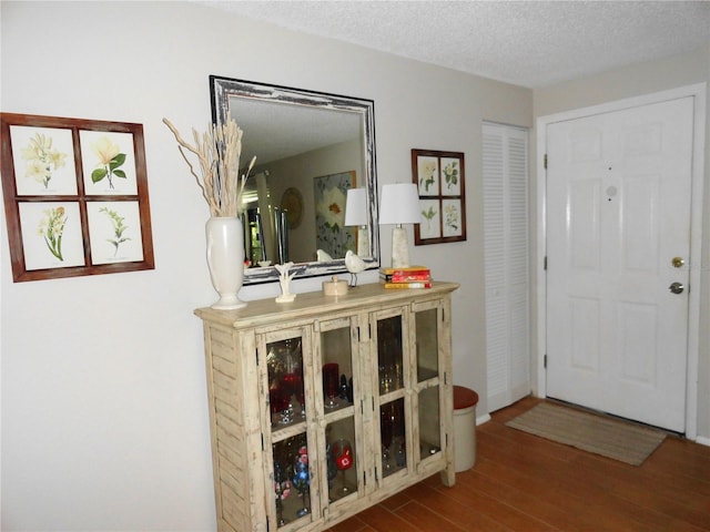 4022 Beaver Ln Unit 700B, Port Charlotte, FL 33952 - entrance foyer featuring wood finished floors and a textured ceiling