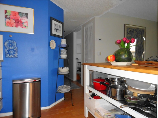 4022 Beaver Ln Unit 700B, Port Charlotte, FL 33952 - kitchen with wood finished floors and a textured ceiling