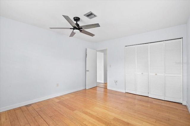 572 Darwin Rd, Venice, FL 34293 - unfurnished bedroom featuring light wood-style floors, a closet, and ceiling fan