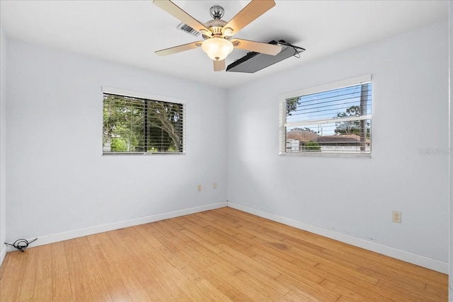 572 Darwin Rd, Venice, FL 34293 - empty room featuring plenty of natural light, light wood-style floors, and ceiling fan