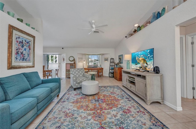 860 Silver Springs Ter NW, Port Charlotte, FL 33948 - living room featuring a ceiling fan, light tile patterned flooring, and lofted ceiling