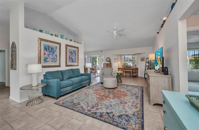 860 Silver Springs Ter NW, Port Charlotte, FL 33948 - living room with healthy amount of natural light, ceiling fan, vaulted ceiling, and light tile patterned flooring