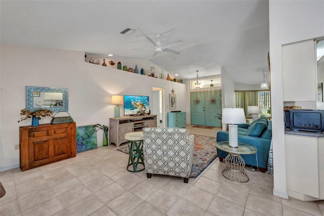 860 Silver Springs Ter NW, Port Charlotte, FL 33948 - living area featuring ceiling fan, vaulted ceiling, and light tile patterned floors
