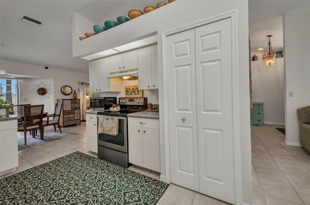 860 Silver Springs Ter NW, Port Charlotte, FL 33948 - kitchen featuring stainless steel appliances, light tile patterned flooring, white cabinetry, and under cabinet range hood