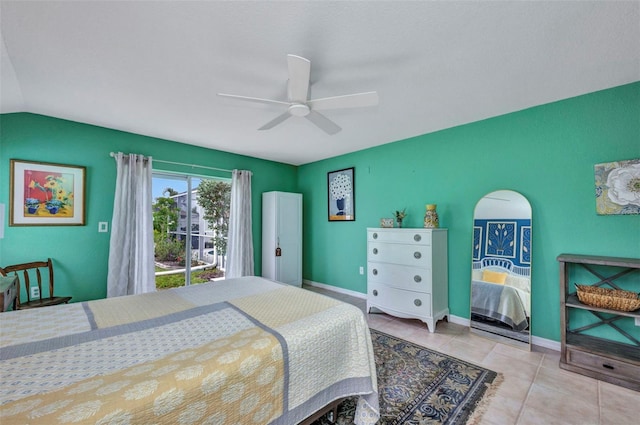 860 Silver Springs Ter NW, Port Charlotte, FL 33948 - bedroom with access to outside, a ceiling fan, tile patterned flooring, and vaulted ceiling