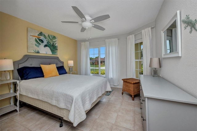 860 Silver Springs Ter NW, Port Charlotte, FL 33948 - bedroom with light tile patterned floors and a ceiling fan