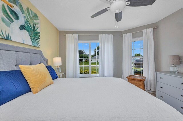 860 Silver Springs Ter NW, Port Charlotte, FL 33948 - bedroom featuring multiple windows and ceiling fan