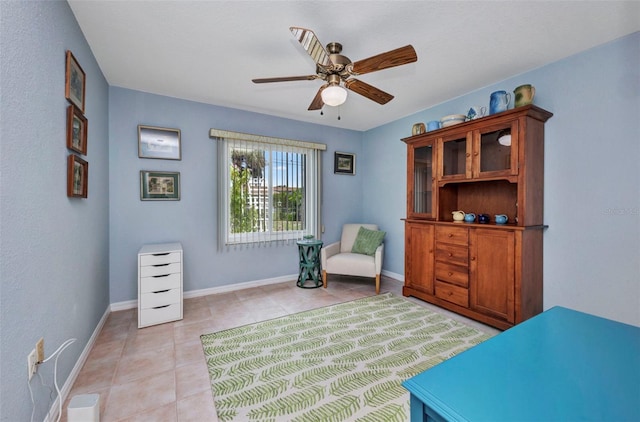 860 Silver Springs Ter NW, Port Charlotte, FL 33948 - living area featuring light tile patterned flooring and a ceiling fan