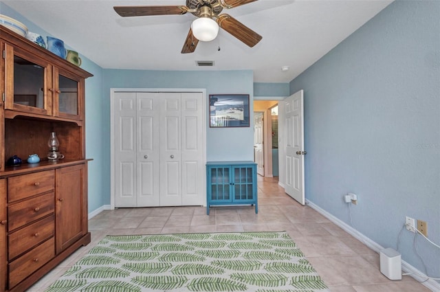 860 Silver Springs Ter NW, Port Charlotte, FL 33948 - bedroom featuring a closet, light tile patterned floors, and ceiling fan