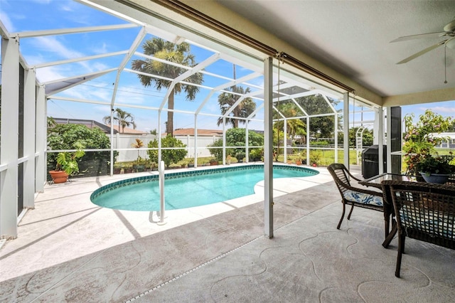 860 Silver Springs Ter NW, Port Charlotte, FL 33948 - outdoor pool featuring a patio area, a ceiling fan, and glass enclosure