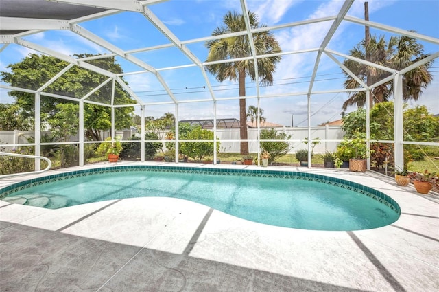 860 Silver Springs Ter NW, Port Charlotte, FL 33948 - outdoor pool with a patio area, a fenced backyard, and glass enclosure