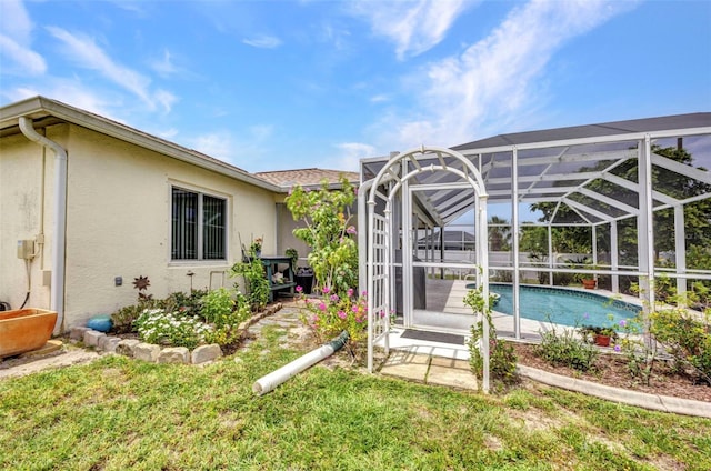 860 Silver Springs Ter NW, Port Charlotte, FL 33948 - view of yard with an outdoor pool, glass enclosure, and a patio
