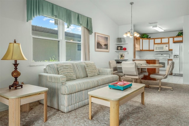 2103 Villaway E, Sebring, FL 33876 - living area featuring a chandelier, light carpet, and lofted ceiling