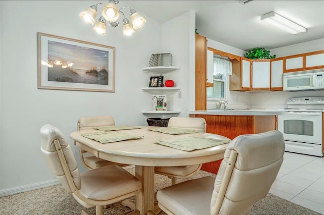 2103 Villaway E, Sebring, FL 33876 - dining room featuring a chandelier and light tile patterned floors