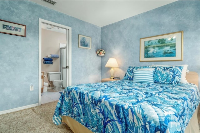 2103 Villaway E, Sebring, FL 33876 - bedroom with carpet flooring, connected bathroom, and tile patterned floors
