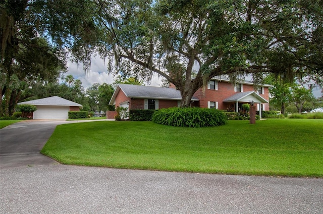 3990 NE Ashley Ter, Arcadia, FL 34266 - view of front of house featuring a front yard and a garage