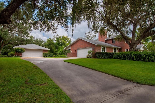3990 NE Ashley Ter, Arcadia, FL 34266 - view of front of property featuring a front yard, a chimney, and brick siding