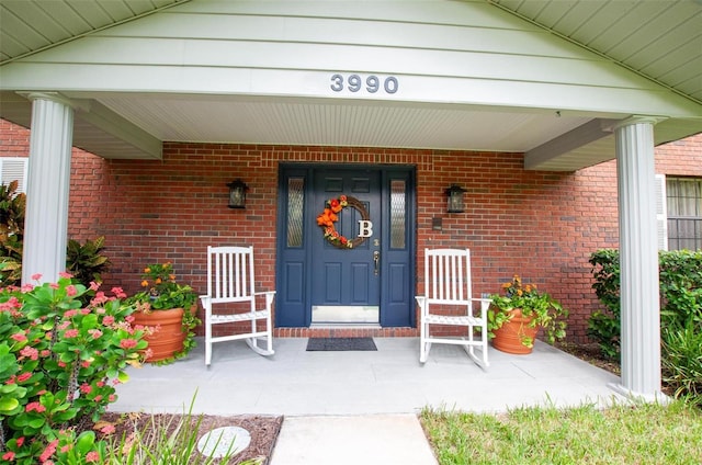 3990 NE Ashley Ter, Arcadia, FL 34266 - view of exterior entry with covered porch and brick siding