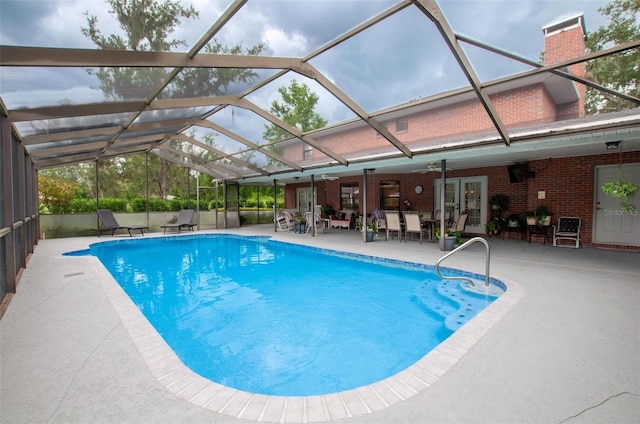 3990 NE Ashley Ter, Arcadia, FL 34266 - outdoor pool with a patio area, glass enclosure, french doors, and outdoor dining space