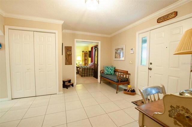3990 NE Ashley Ter, Arcadia, FL 34266 - entryway with crown molding, light tile patterned floors, and a textured ceiling