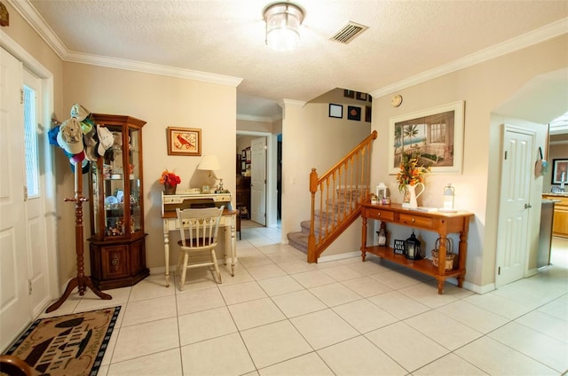 3990 NE Ashley Ter, Arcadia, FL 34266 - foyer entrance featuring stairway, ornamental molding, light tile patterned floors, and a textured ceiling