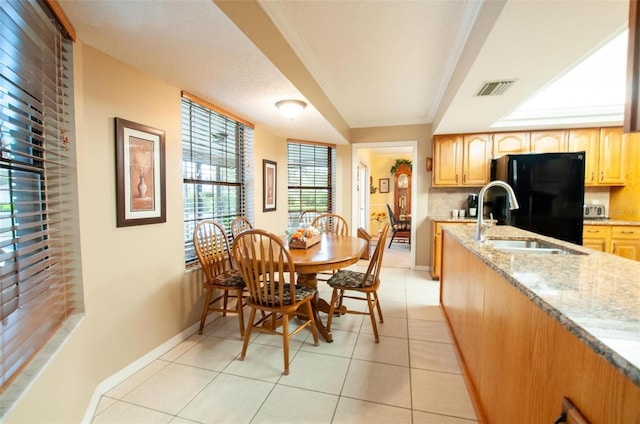 3990 NE Ashley Ter, Arcadia, FL 34266 - dining space featuring crown molding and light tile patterned floors
