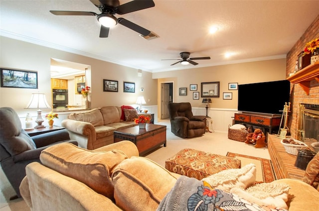 3990 NE Ashley Ter, Arcadia, FL 34266 - living area featuring a ceiling fan, wainscoting, ornamental molding, carpet, and a fireplace