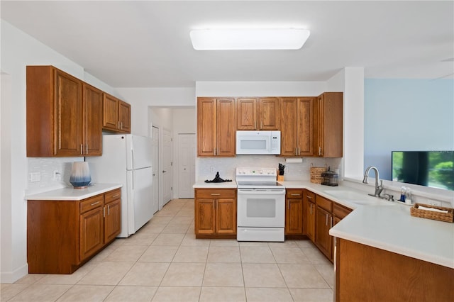 3820 Cobia Villas Ct, Punta Gorda, FL 33955 - kitchen with white appliances, brown cabinetry, backsplash, light tile patterned floors, and light countertops