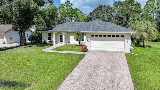 2697 Parrot St, North Port, FL 34286 - single story home featuring stucco siding, an attached garage, a front yard, driveway, and a shingled roof