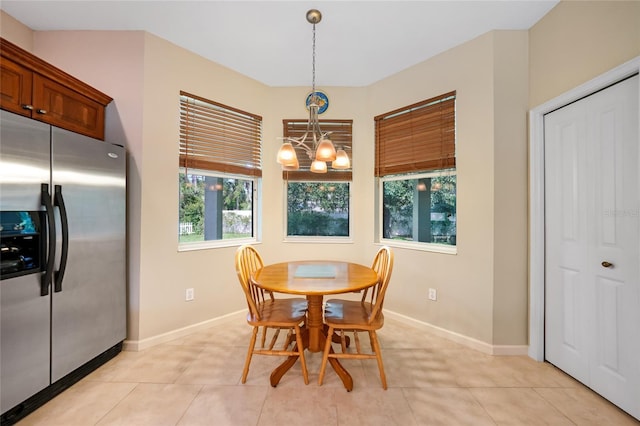 2697 Parrot St, North Port, FL 34286 - dining area with a chandelier, healthy amount of natural light, and light tile patterned floors
