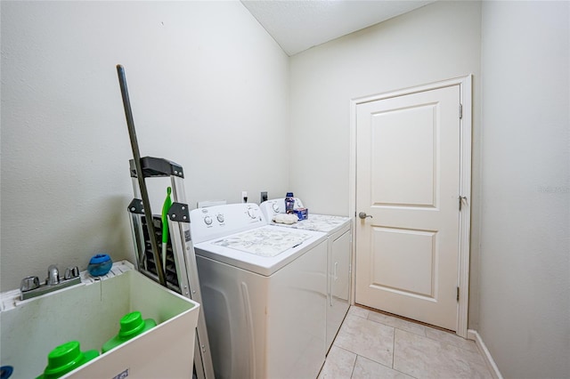 2697 Parrot St, North Port, FL 34286 - washroom with independent washer and dryer and light tile patterned floors