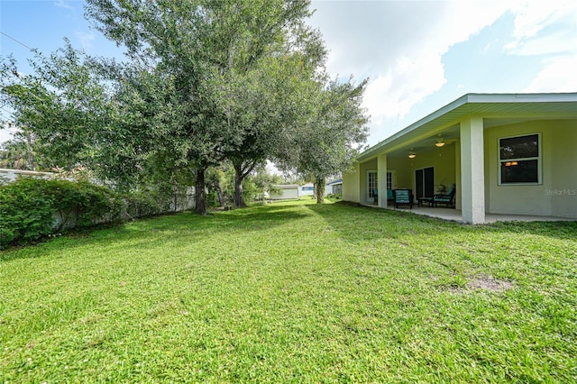 2697 Parrot St, North Port, FL 34286 - view of green lawn with ceiling fan and a patio area
