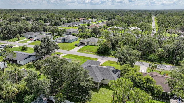 2697 Parrot St, North Port, FL 34286 - aerial perspective of suburban area with a heavily wooded area