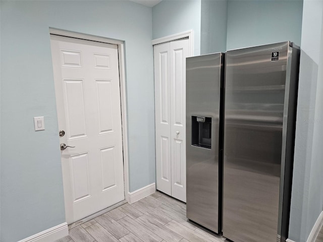 9471-9473 Agate St, Port Charlotte, FL 33981 - kitchen with stainless steel fridge with ice dispenser and light wood-style flooring