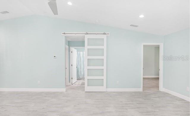 9471-9473 Agate St, Port Charlotte, FL 33981 - spare room with vaulted ceiling, light wood-style flooring, a ceiling fan, and recessed lighting