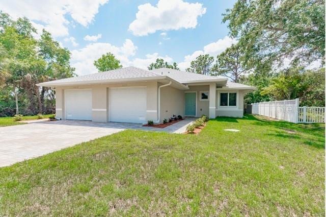 9471-9473 Agate St, Port Charlotte, FL 33981 - single story home with driveway, stucco siding, and an attached garage