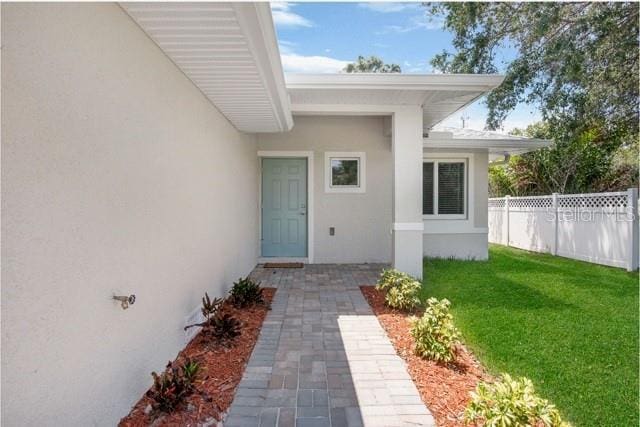 9471-9473 Agate St, Port Charlotte, FL 33981 - property entrance featuring stucco siding