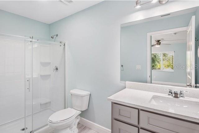 9471-9473 Agate St, Port Charlotte, FL 33981 - bathroom featuring a stall shower, vanity, and ceiling fan