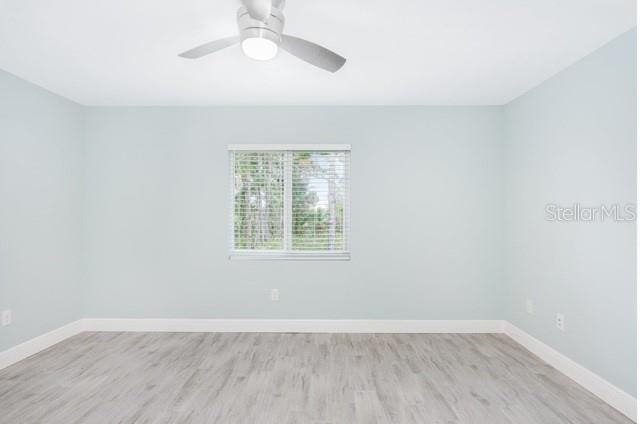 9471-9473 Agate St, Port Charlotte, FL 33981 - empty room with light wood-type flooring and ceiling fan