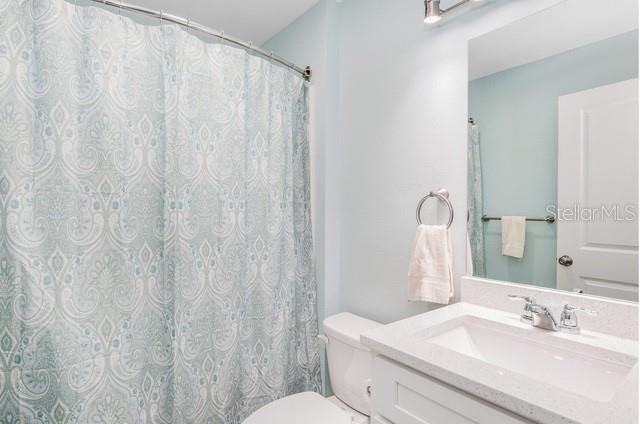 9471-9473 Agate St, Port Charlotte, FL 33981 - bathroom with toilet and vanity