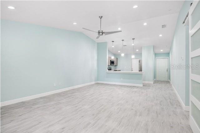 9471-9473 Agate St, Port Charlotte, FL 33981 - unfurnished living room with a ceiling fan, light wood-style flooring, and recessed lighting